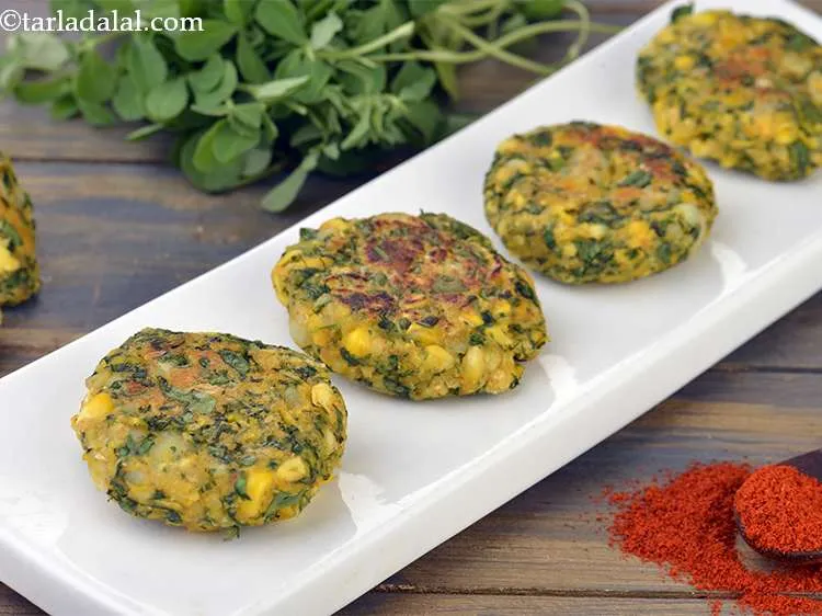 Step 18 – Remove on a plate and serve<strong> corn methi kebab</strong> (<strong>corn methi tikki</strong>) immediately with a …