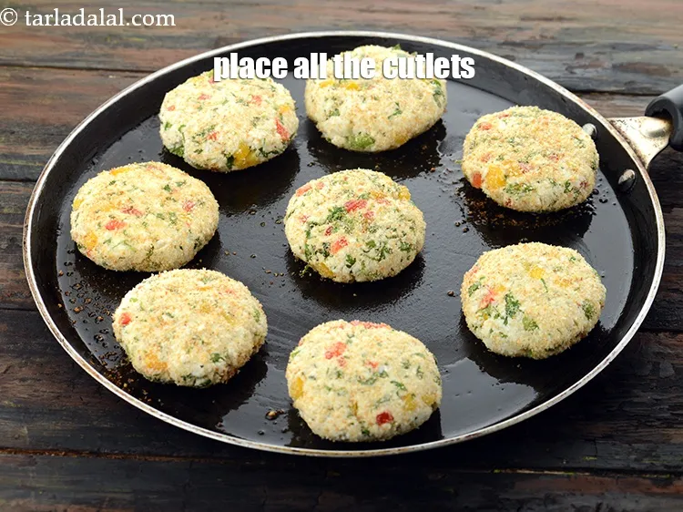 Step 23 – Place all the cutlets on the greased hot tava (griddle) .&nbsp;