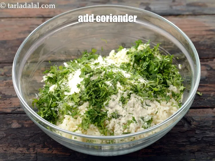 Step 12 – Add 1/4 cup&nbsp;finely chopped&nbsp;<a href="https://www.tarladalal.com/glossary-coriander-dhania-kothmir-369i">coriander (dhania)</a>.&nbsp;