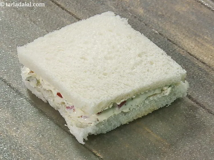 Step 14 – Cover it with another bread slice with the buttered side facing downwards.