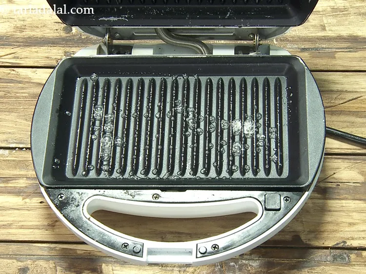 Step 18 – Grease the lower side of a sandwich grilled using little butter.&nbsp;