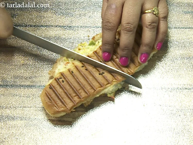 Step 22 – Cut the panini diagonally into 2 equal pieces.