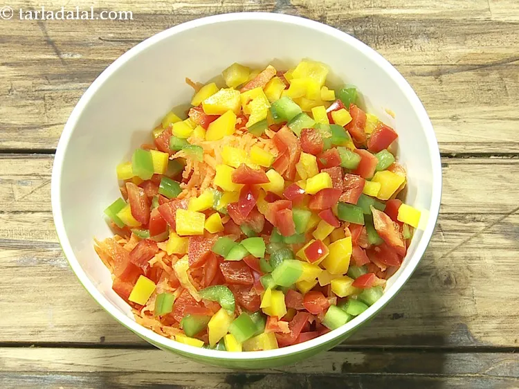 Step 5 – Add 1/2 cup&nbsp;chopped capsicum (<a href="https://www.tarladalal.com/glossary-chopped-red-capsicum-2299i">red</a>,&nbsp;<a href="https://www.tarladalal.com/glossary-chopped-capsicum-164i">green</a>&nbsp;and&nbsp;<a href="https://www.tarladalal.com/glossary-chopped-yellow-capsicum-2300i">yellow</a>).