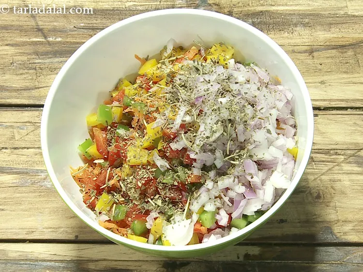 Step 7 – Add 2 tsp&nbsp;<a href="https://www.tarladalal.com/glossary-dried-mixed-herbs-466i">dried mixed herbs</a>.