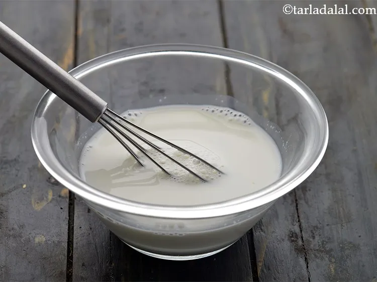 Step 9 – Add the fresh cream and whisk well to form a lump-free slurry. Mix well till …