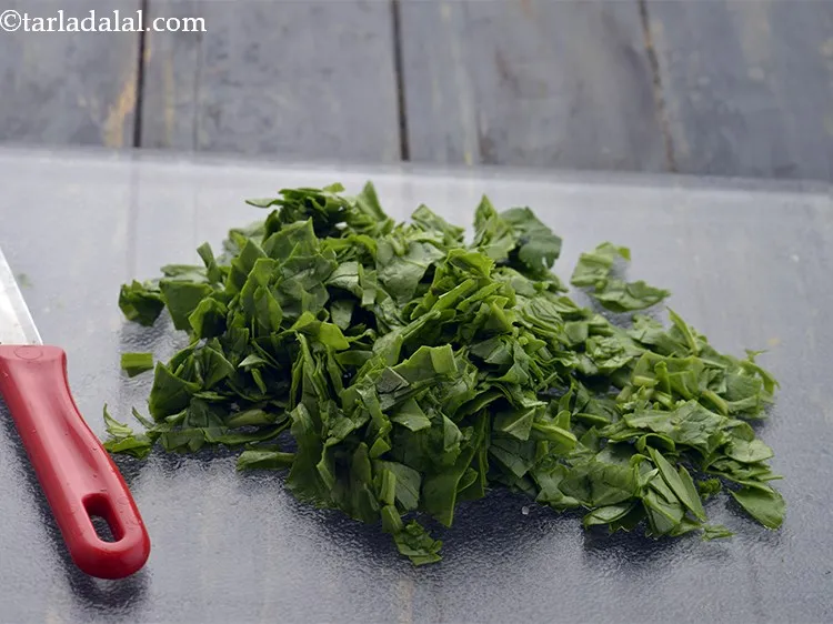 Step 6 – Finely chop the spinach leaves using a sharp knife.