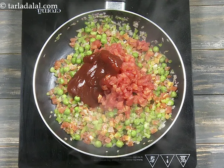 Step 12 – Add 1/4 cup&nbsp;<a href="https://www.tarladalal.com/glossary-tomato-ketchup-tomato-sauce-181i">tomato ketchup</a>.