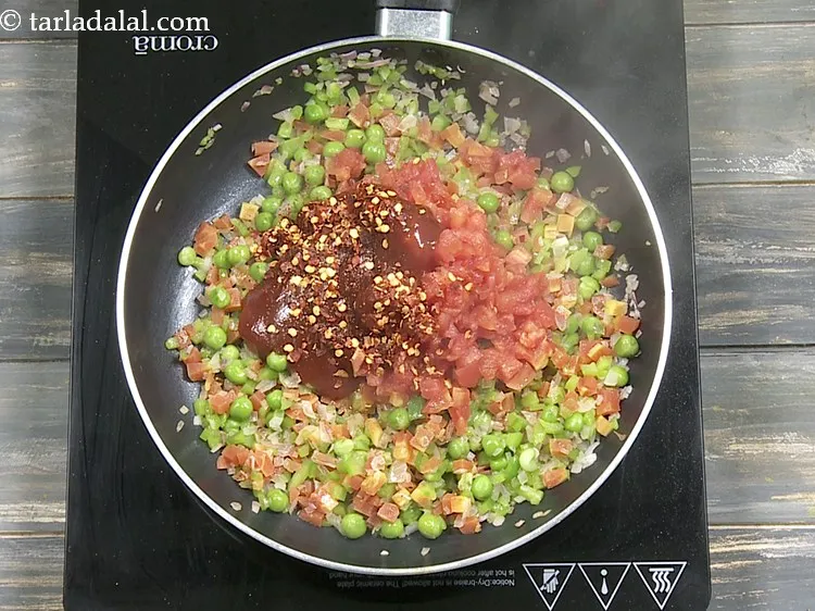 Step 13 – Add 2 tsp&nbsp;<a href="https://www.tarladalal.com/glossary-dry-red-chilli-flakes-paprika-338i">dry red chilli flakes (paprika)</a>.