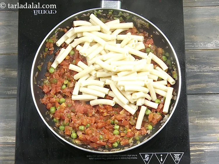 Step 16 – Finally add 1 1/2 cups&nbsp;<a href="https://www.tarladalal.com/glossary-cooked-macaroni-1894i">boiled macaroni</a>.