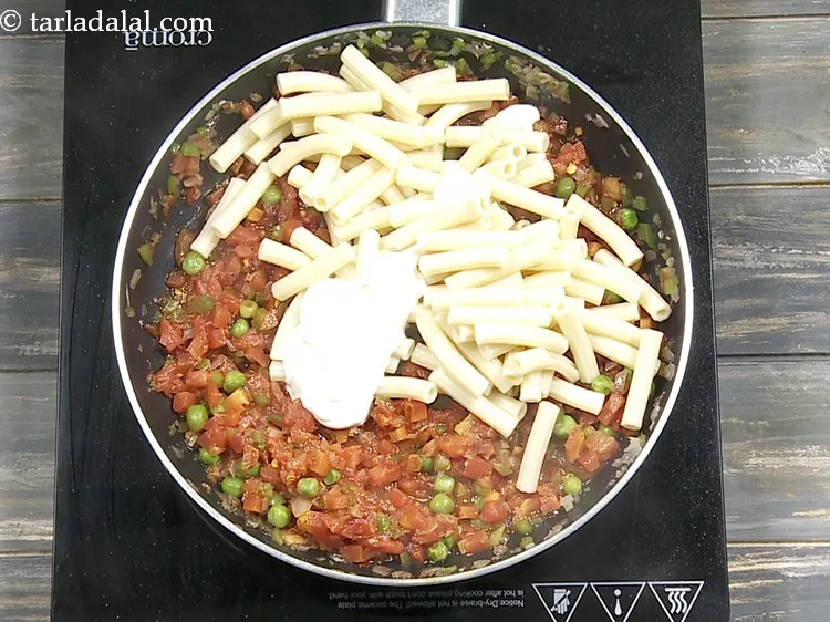 Step 17 – Add 2 tbsp&nbsp;<a href="https://www.tarladalal.com/glossary-fresh-cream-1877i">fresh cream</a>. This adds creaminess to the macaroni.&nbsp;