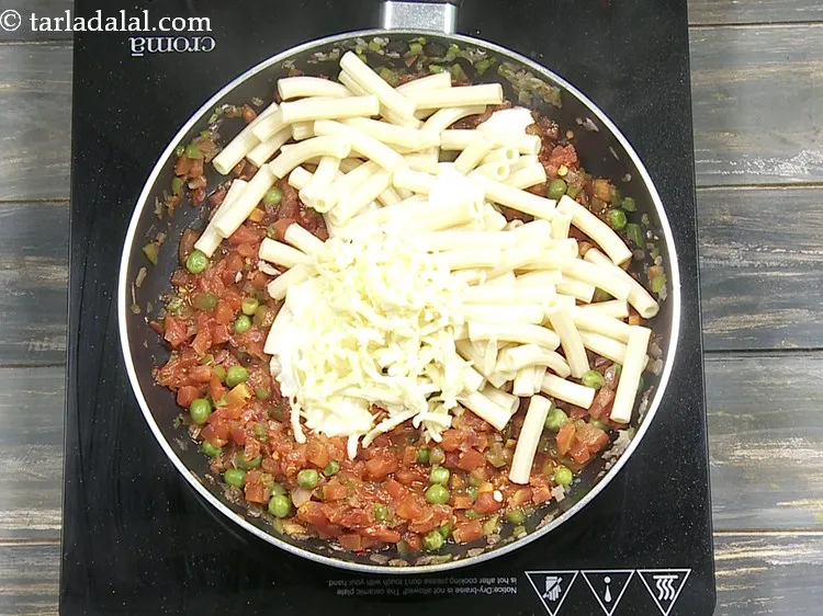 Step 18 – Add 1/4 cup&nbsp;<a href="https://www.tarladalal.com/glossary-grated-processed-cheese-868i">grated processed cheese</a>.