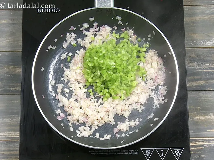 Step 6 – Add 1/2 cup&nbsp;finely&nbsp;<a href="https://www.tarladalal.com/glossary-chopped-capsicum-164i">chopped capsicum</a>.