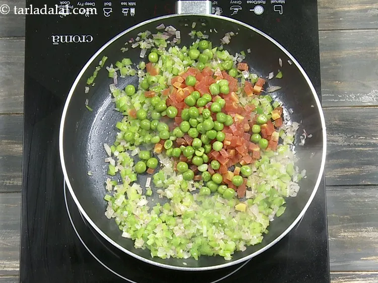 Step 9 – Add 1/4 cup&nbsp;<a href="https://www.tarladalal.com/glossary-boiled-green-peas-1078i">boiled green peas</a>. If you wish you can substitute it with blanched …