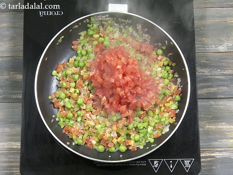 Step 11 – Add 1 cup&nbsp;<a href="https://www.tarladalal.com/glossary-blanched-and-chopped-tomatoes-1883i">blanched and chopped tomatoes</a>.