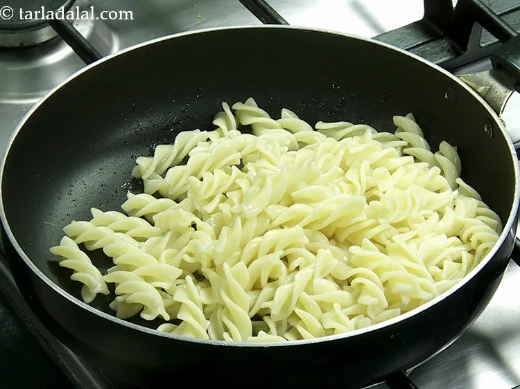 Step 28 – Once the oil is hot, add the fusilli. You can use any variety of pasta …
