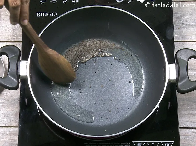 Step 8 – Saut&eacute; the seeds on a medium flame for a few seconds. They will crackle.&nbsp;