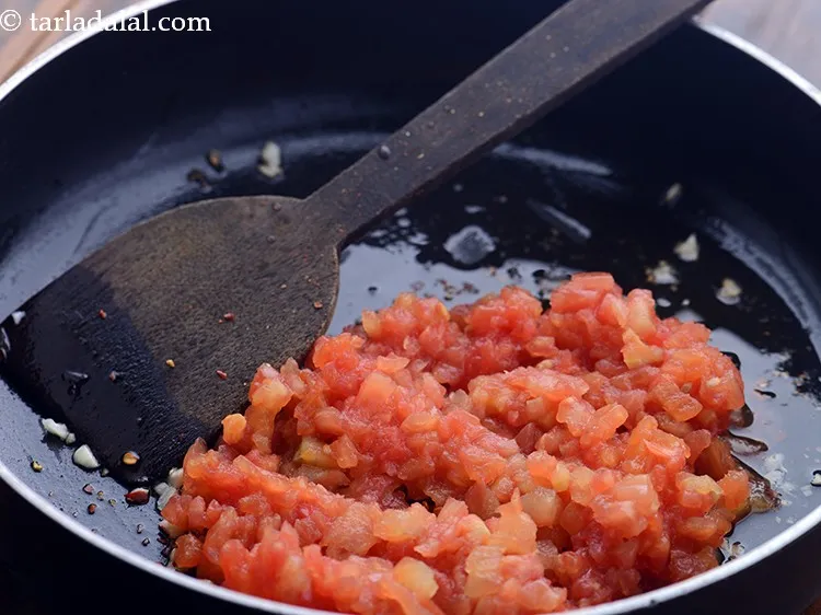 Step 6 – Add blanced and chopped tomatoes.&nbsp;