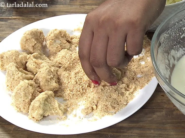 Step 17 – Roll in the bread crumbs till they are evenly coated from all the sides. Similarly, …