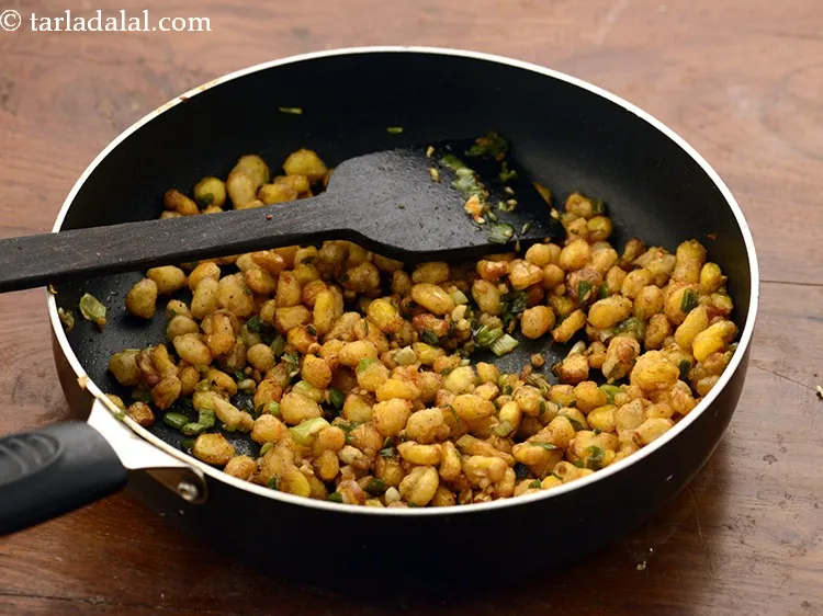 Step 31 – Mix well and toss on a medium flame for 1 minute.&nbsp;