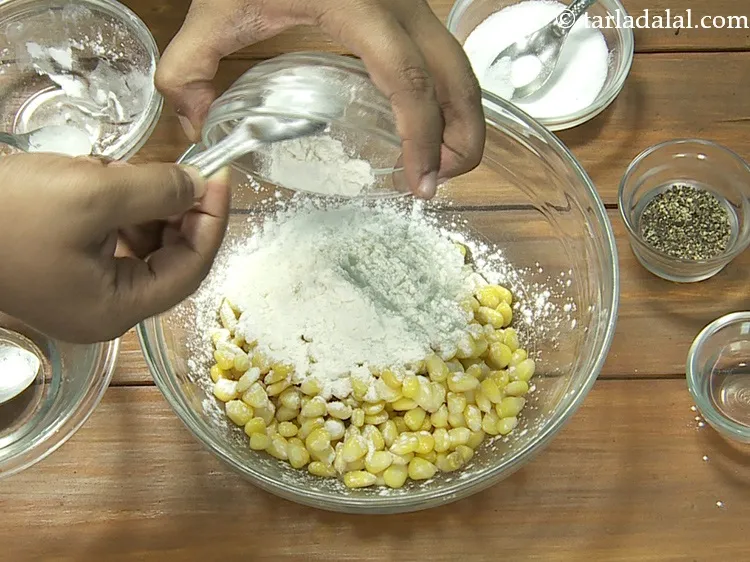 Step 10 – Add 4 tbsp&nbsp;<a href="https://www.tarladalal.com/glossary-cornflour-cornstarch-maize-starch-corn-flour-112i">cornflour</a>. This adds crispness to the crispy fried corn.