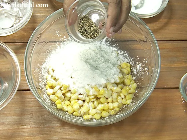 Step 12 – Add <a href="https://www.tarladalal.com/glossary-freshly-ground-black-pepper-kalimirch-powder-kali-mirch-ka-powder-567i">freshly ground black pepper (kalimirch)</a>&nbsp;to taste.