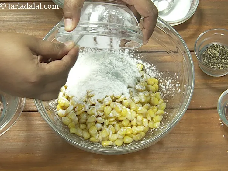 Step 9 – Add 2 tbsp&nbsp;<a href="https://www.tarladalal.com/glossary-plain-flour-maida-188i">plain flour (maida)</a>.