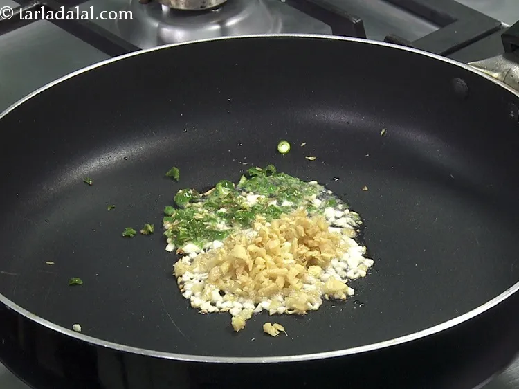 Step 24 – Add 1 tsp&nbsp;finely&nbsp;<a href="https://www.tarladalal.com/glossary-chopped-green-chilli-820i">chopped green chillies</a>.