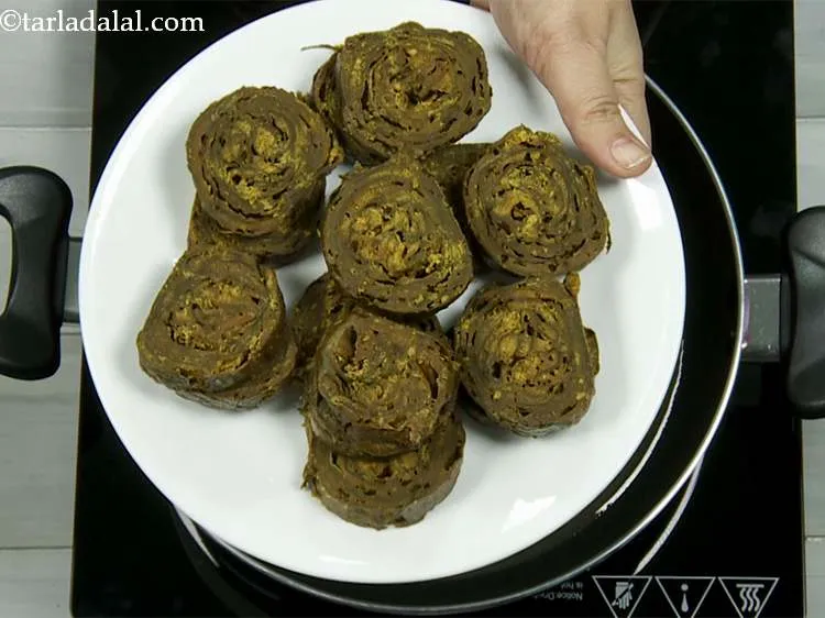 Step 1 – Patra is a popular Gujarati savoury snack made using colocassia leaves. Check our <a href="/Patra-(-Non---Fried-Snacks-)-How-To-Make-Gujarati-Patra-33322r">detailed …