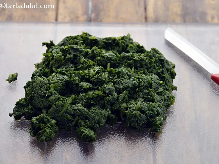 Step 9 – Cool it down slightly, Thereafter, finely chop the palak.&nbsp;