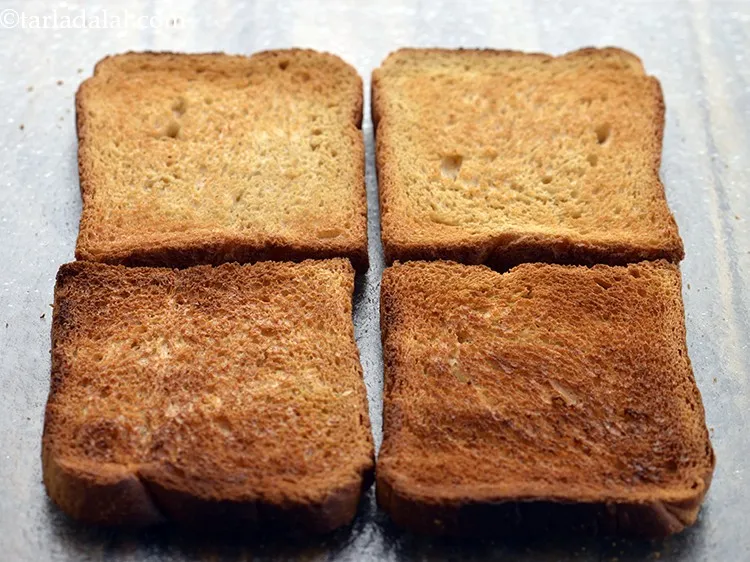 Step 16 – To make the&nbsp;<strong>Crispy Spinach and Paneer Open Toast</strong>, toast 4 brown bread slices in an …