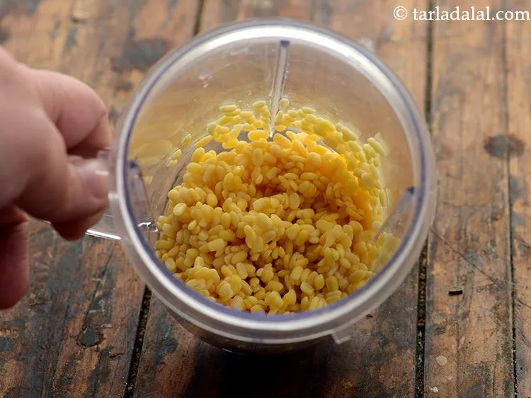 Step 4 – Transfer the moong dal into a small mixer jar.
