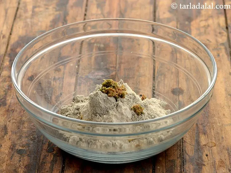 Step 9 – Now add spices to make <strong>methi bajra crispies</strong>. First add the ginger-green chilli paste. Paste …