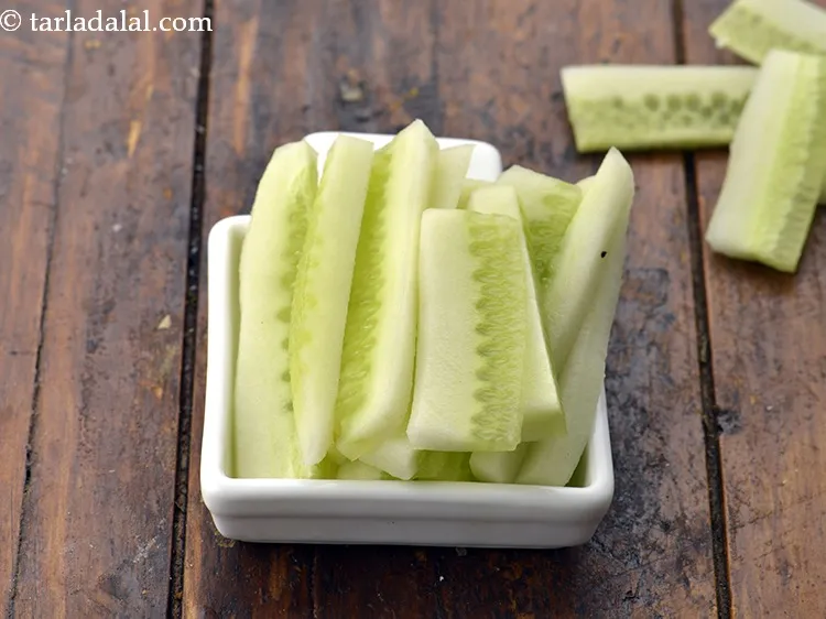 Step 31 – Add 1/2 cup&nbsp;thick&nbsp;<a href="https://www.tarladalal.com/glossary-cucumber-strips-1075i">cucumber sticks</a>.