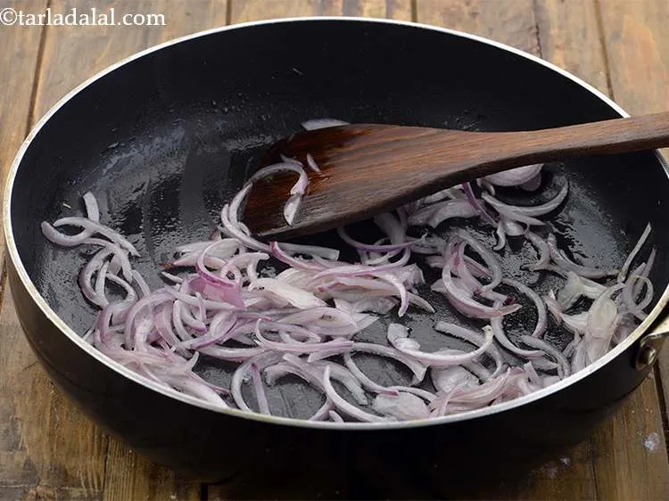 Step 6 – Heat 2 tbsp oil in a pan and saut&eacute; the sliced onions for 30 seconds …