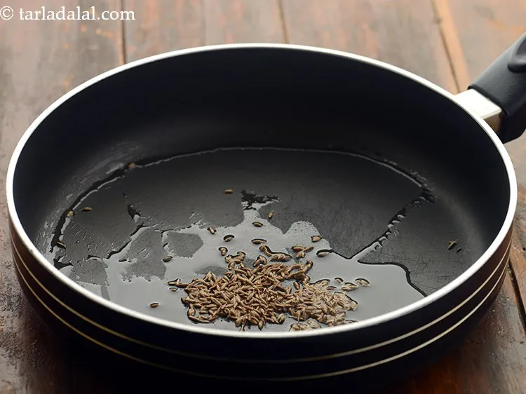 Step 13 – Once the oil is hot, add the cumin seeds.