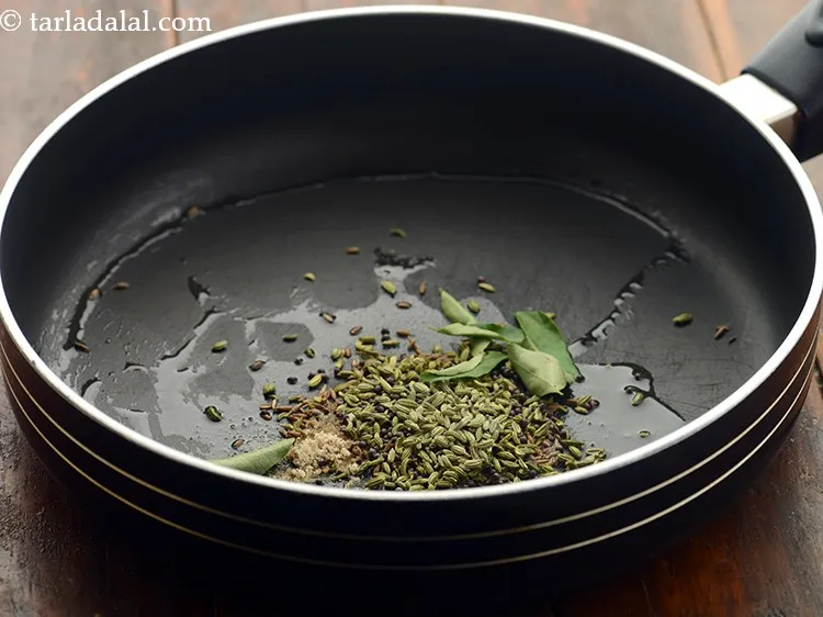 Step 16 – Add asafoetida and curry leaves.