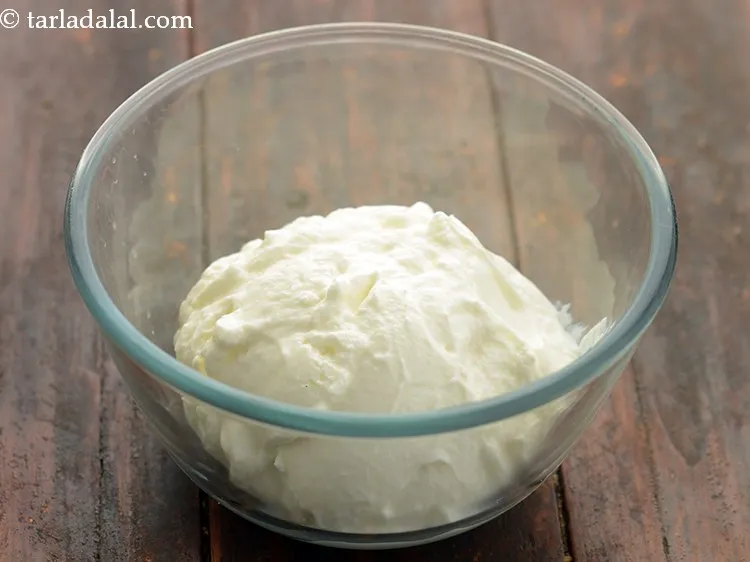Step 5 – In a deep bowl, take curd.
