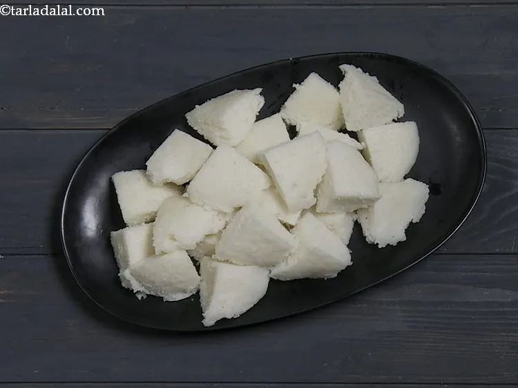 Step 12 – To make the <strong>curd idli</strong>, arrange the idlis on a serving plate. If making fresh …