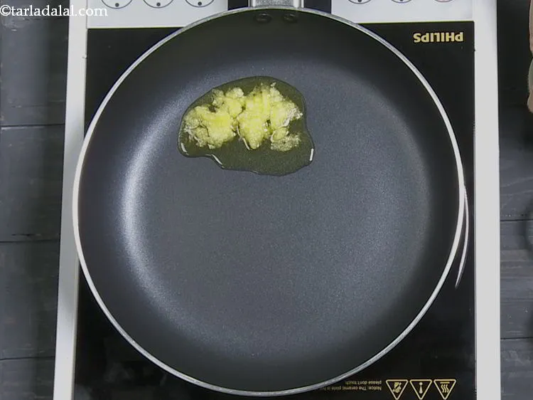 Step 5 – For tempering the thalicha <strong>thayir idli</strong>, heat the ghee in a small non-stick pan. Ghee …