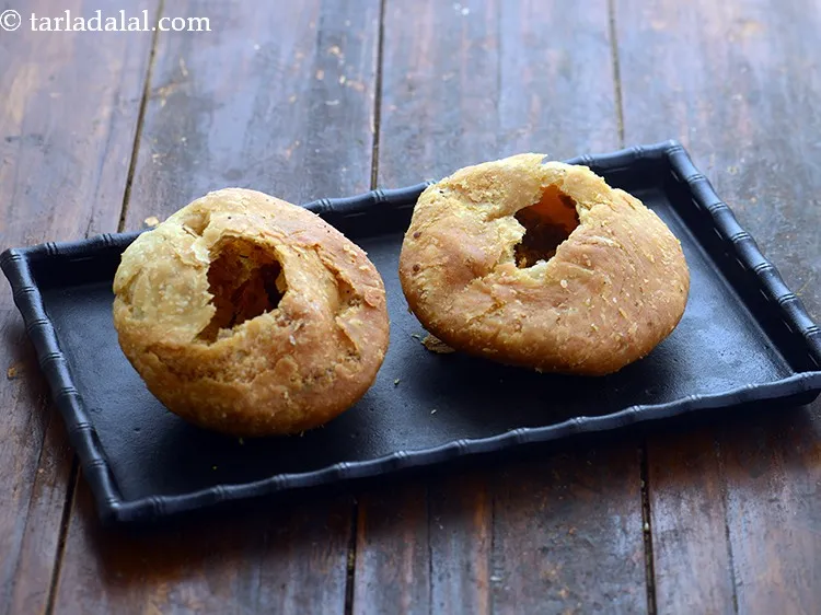 Step 43 – Make a hole in the centre of each kachori.