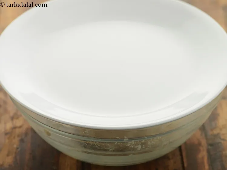 Step 9 – Cover the dough with a damp muslin cloth and keep aside for 15 to 20 …