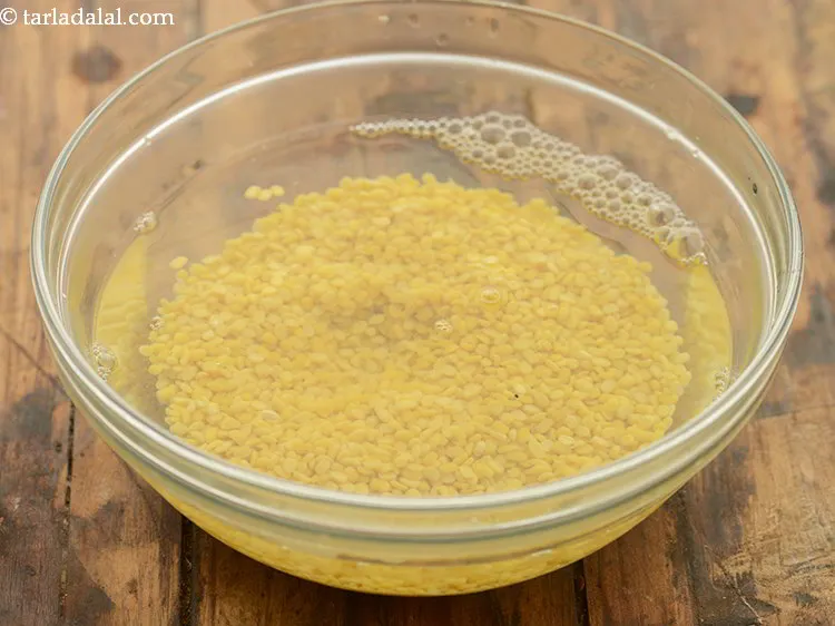 Step 10 – To make the filling for <strong>khasta kachori</strong>, wash and soak the yellow moong dal in …