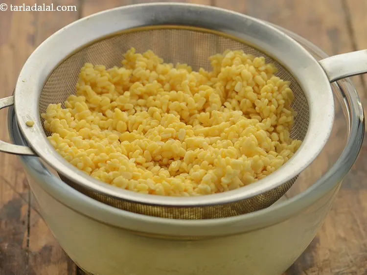 Step 12 – After soaking, drain the moong dal using a strainer.