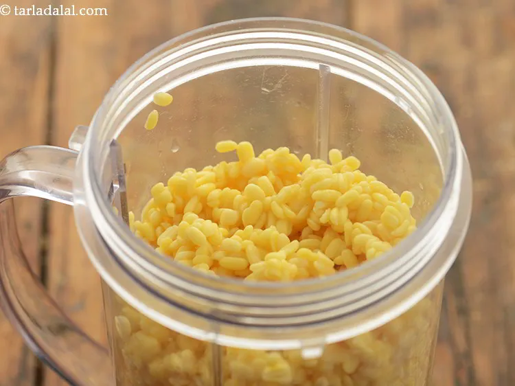 Step 13 – Transfer the soaked and drained dal to a mixer jar.