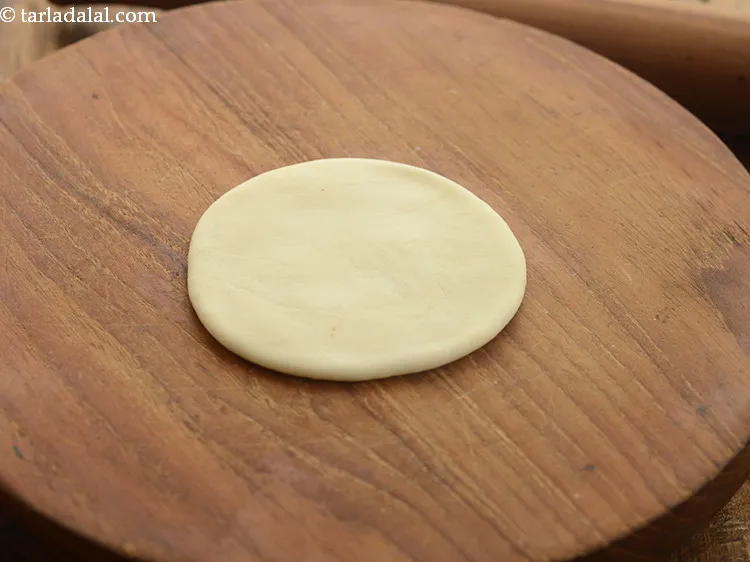 Step 29 – Roll out each portion of the dough into a 75 mm. (3&quot;) diameter circle.