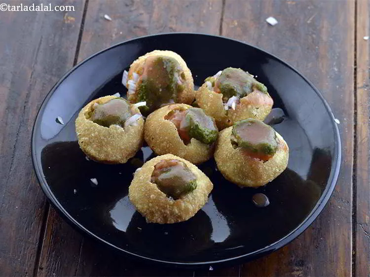 Step 16 – Also top the&nbsp;<strong>Dahi Puris</strong>&nbsp;with 1 tsp <em>khajur imli ki chutney</em>. You can use store bought …