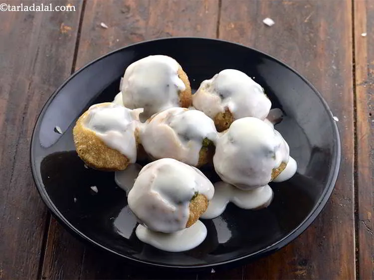 Step 17 – Now top each puri with approx. 1 tbsp of curd. Make sure the curd is …