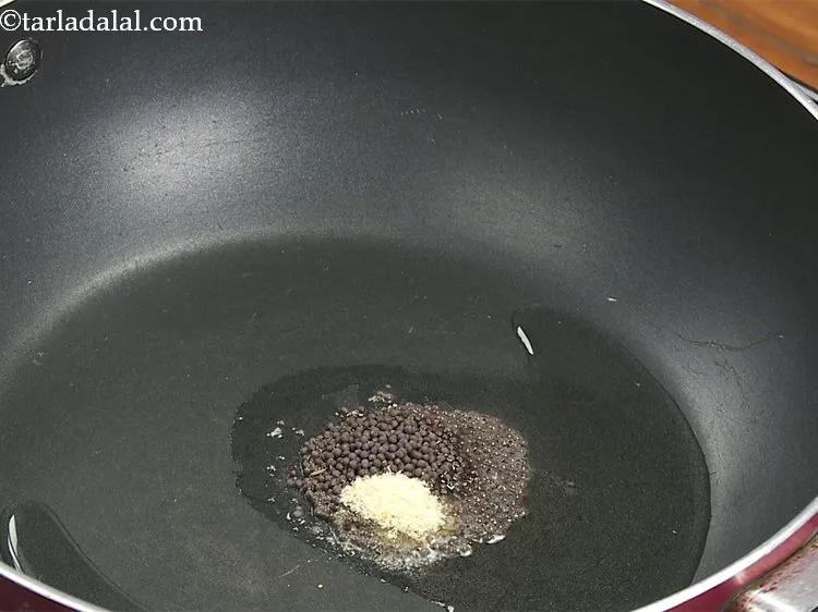 Step 12 – Add asafoetida and saut&eacute; on a medium flame for 30 seconds.