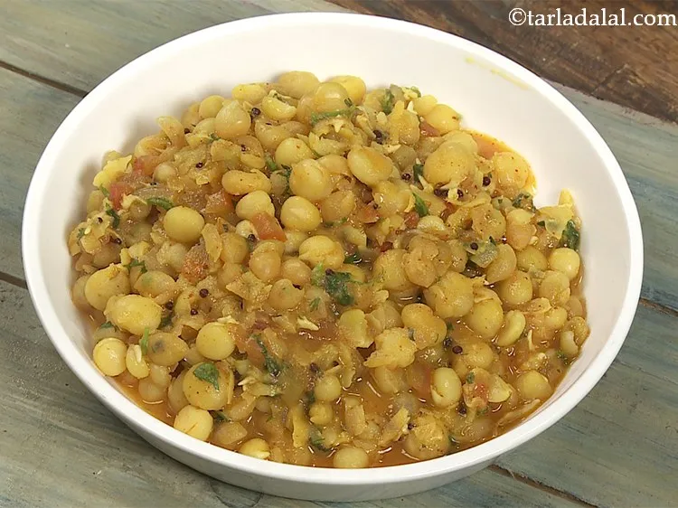 Step 28 – Put a portion of the ragda in a serving bowl.