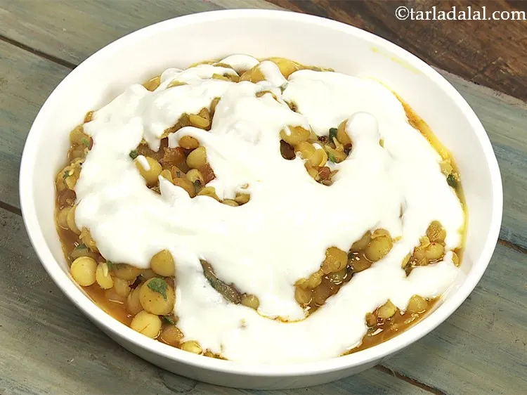 Step 29 – Pour &frac14; cup of whisked curd. I have used homemade fresh curd for this recipe. …